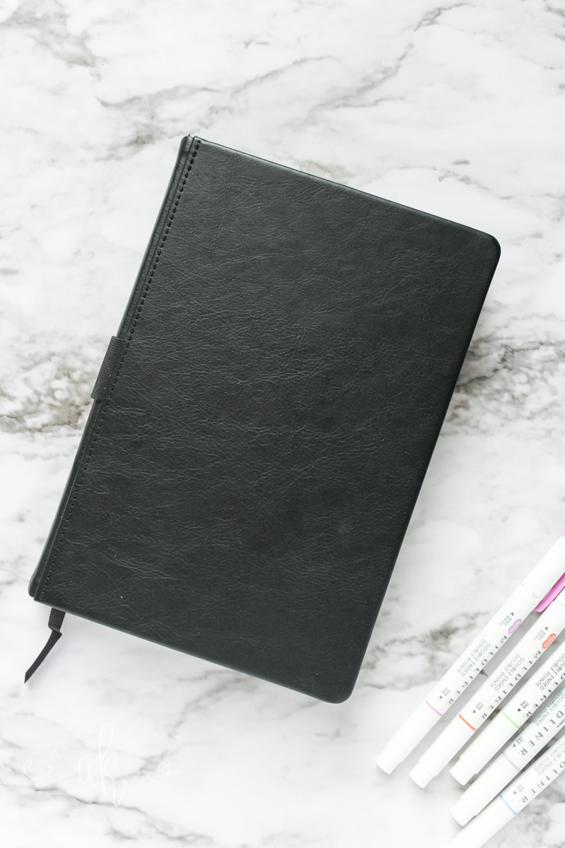 black lemome bullet journal with mildliners