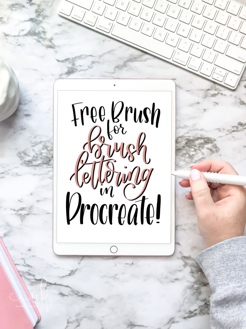hand lettering displayed on an ipad on marble background