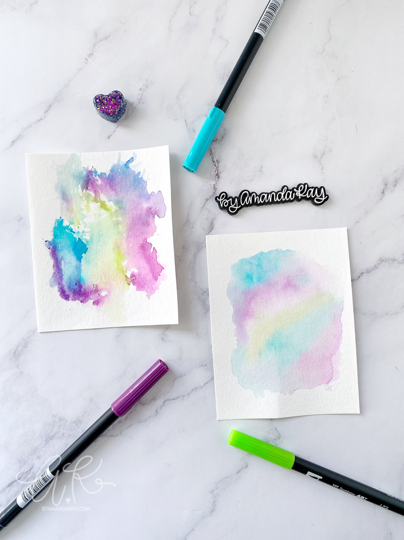Watercolor backgrounds flat lay image with Tombow markers